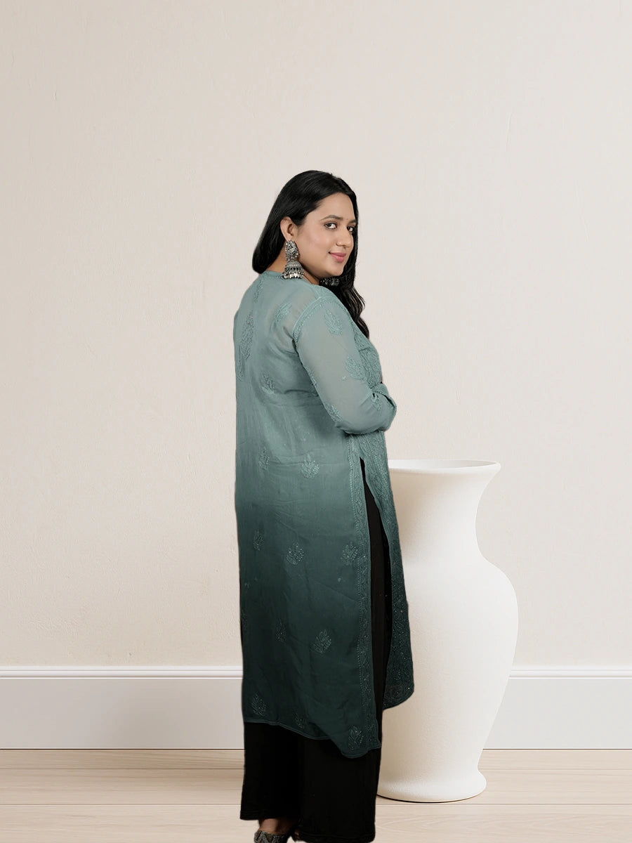 Lightweight Masleen fabric outfit with fine Chikankari embroidery, featuring soft drape and intricate hand-stitched patterns