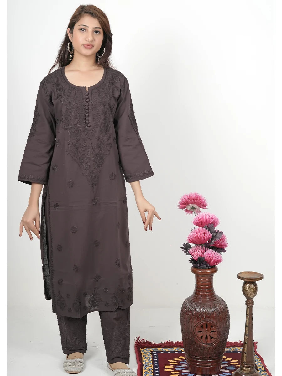 Model wearing deep cocoa brown mulmul chikankari kurti with matching embroidered pants
