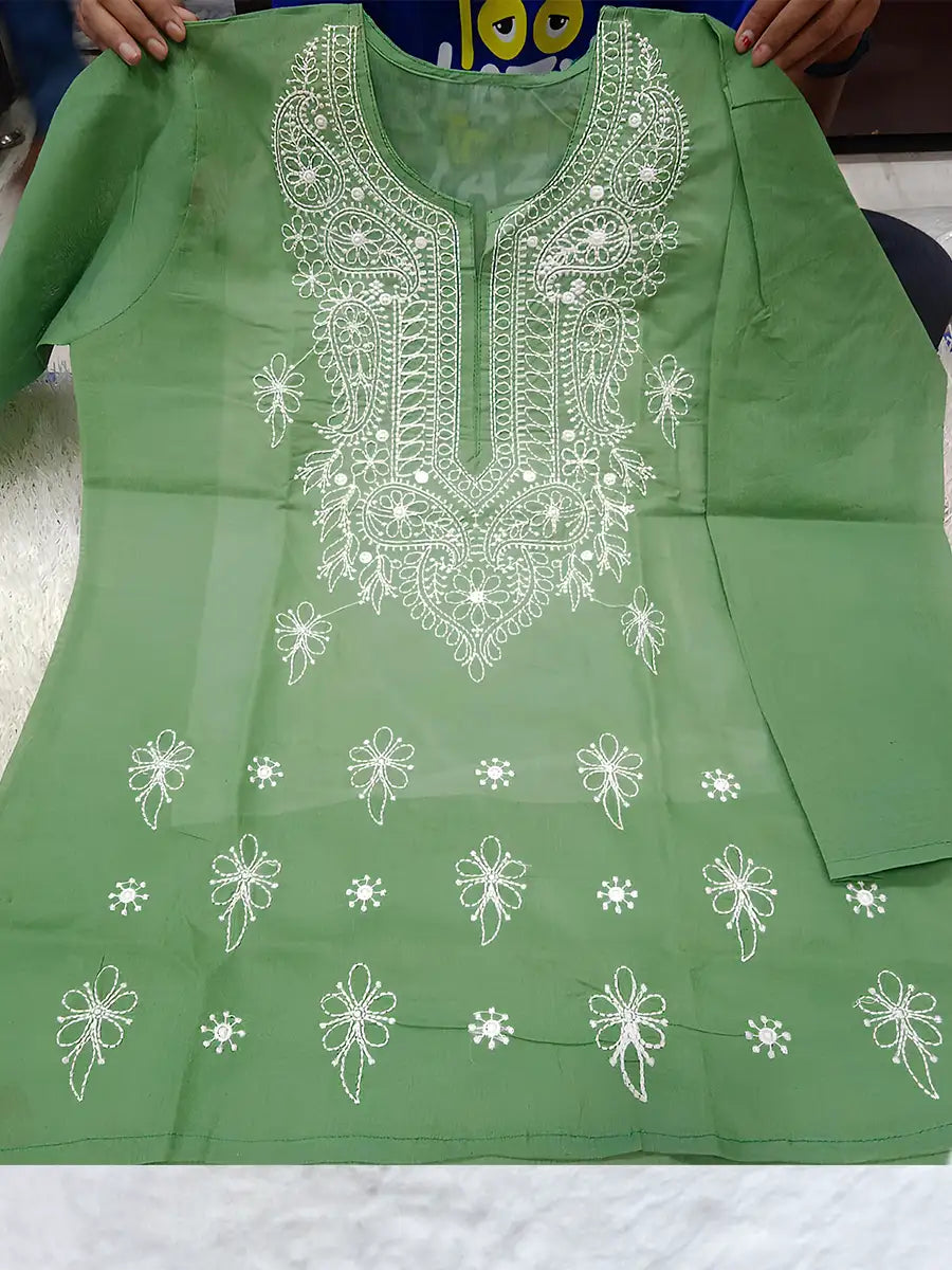 Parrot green short kurti in Rubiya Cotton with intricate white machine embroidery on neck and booti pattern