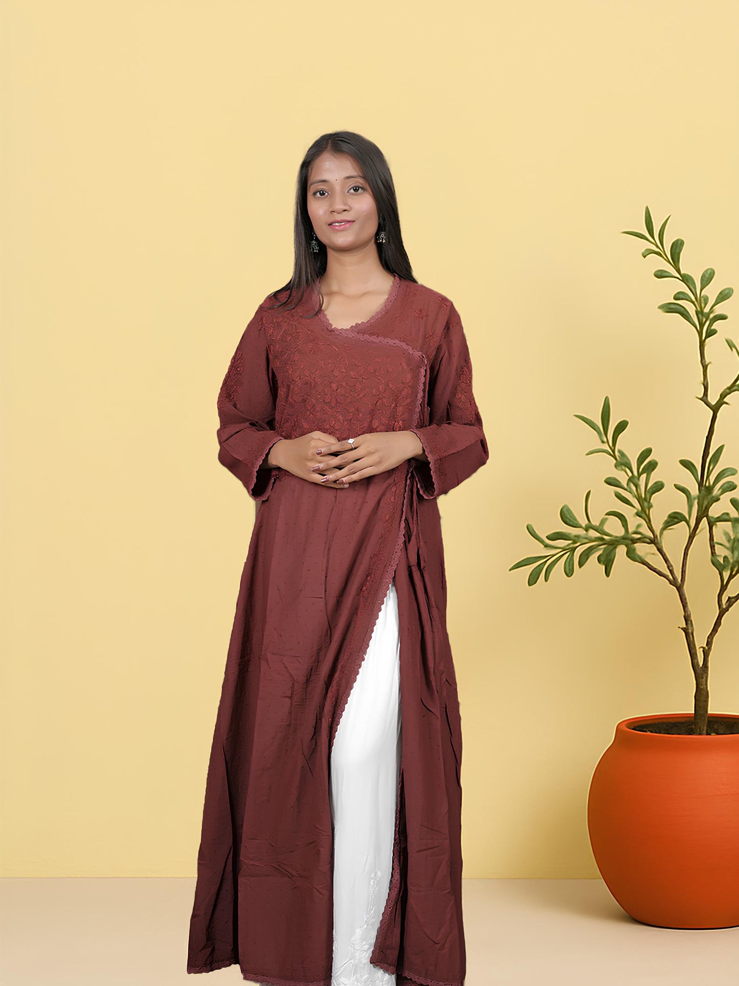 Model in maroon Angrakha kurta featuring V-neckline and hand embroidery