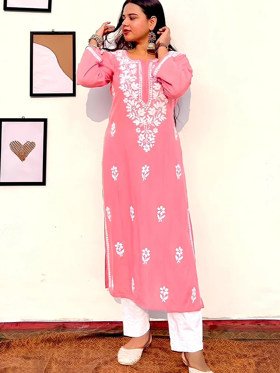 Soft coral pink rayon kurti featuring delicate white gala booti embroidery for a light festive look.