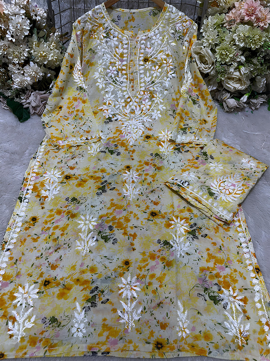 Yellow mul mul palazzo kurti set with all-over floral print and Chikankari work
