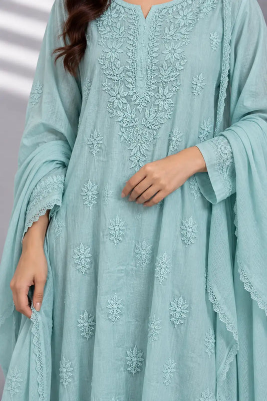 A close-up of a woman wearing a light blue-green embroidered kurta with matching embroidered dupatta. The kurta features intricate floral embroidery on the chest and scattered motifs on the skirt, with lace-trimmed cuffs.