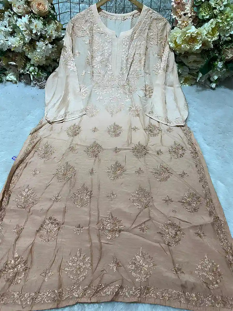Beige masleen fancy kurti with delicate boti and bota design work on front panel.


