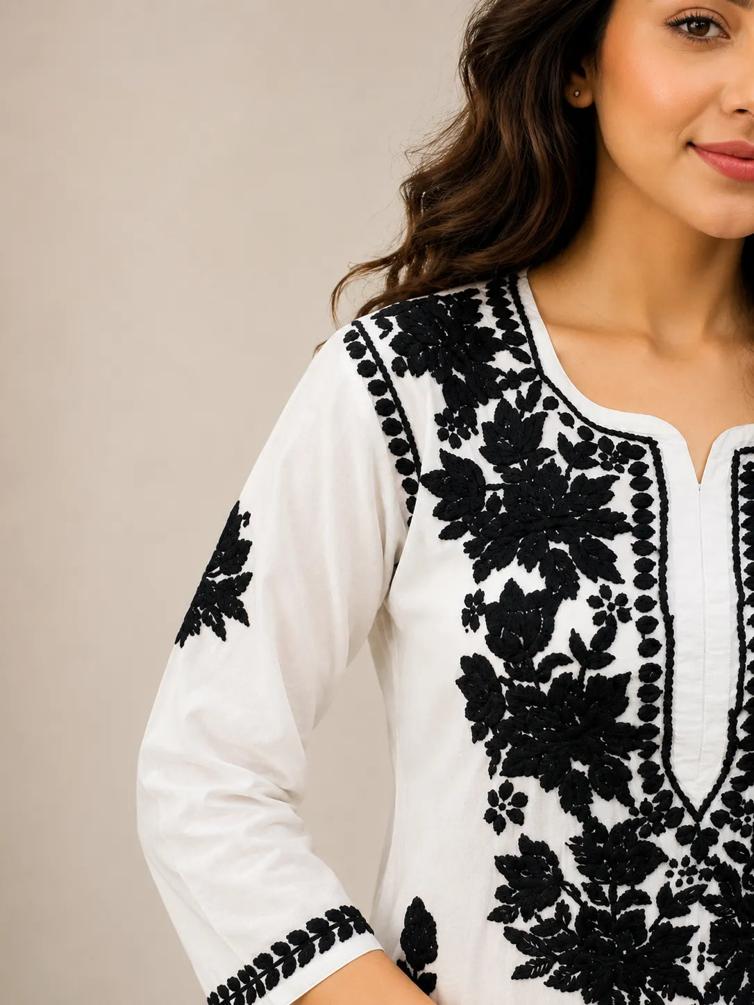 Black rose work detailing on white modal kurti