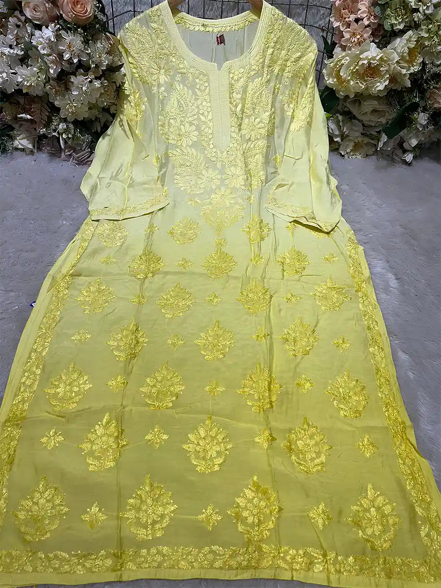 Bright yellow embroidered masleen kurti with soft sheen and full-length design.

