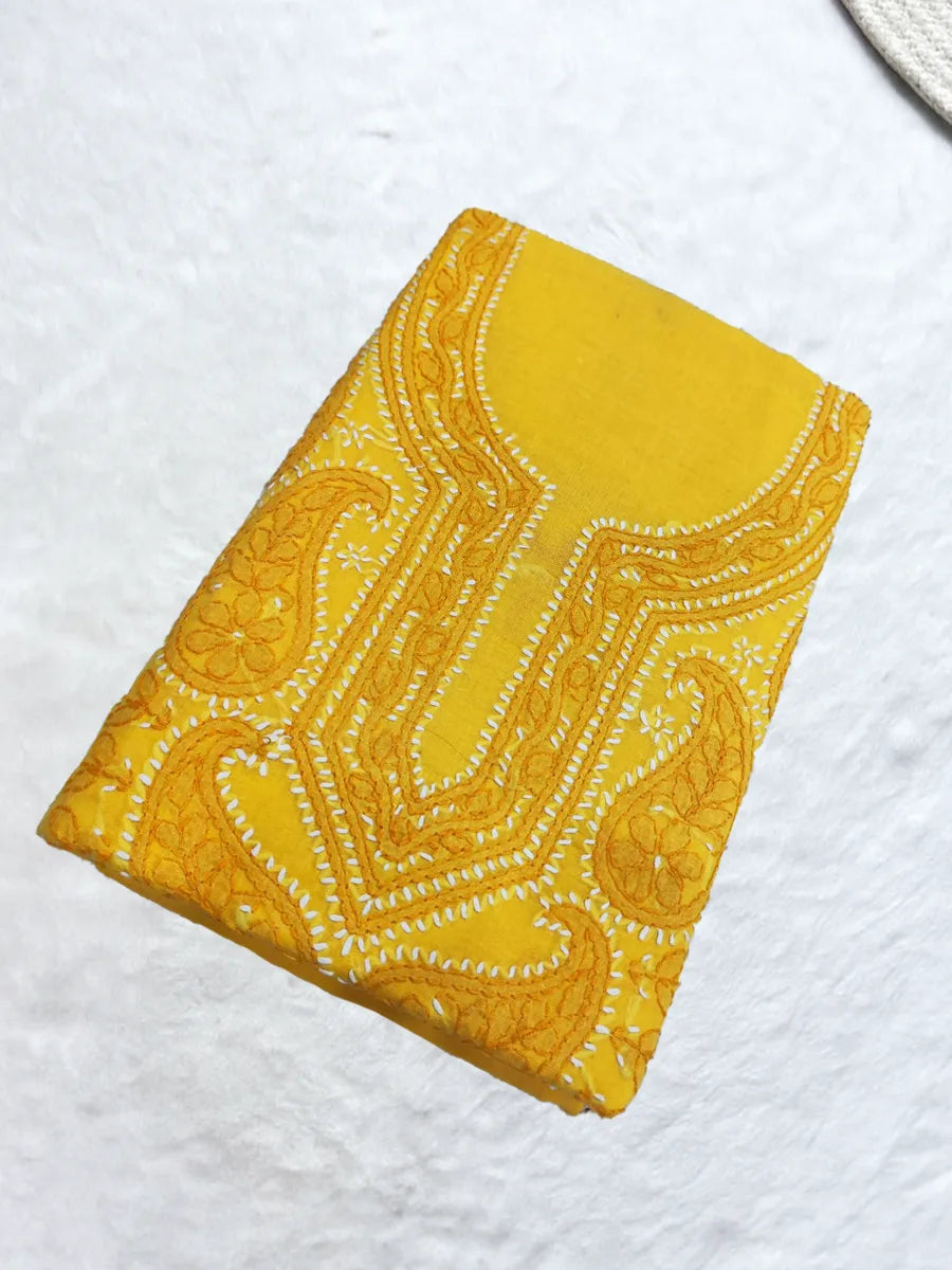 Bright yellow voile cotton dress material with delicate white shadow and fanda embroidery, ideal for haldi ceremonies and summer wear, displayed on a flat lay with elegant ethnic styling.