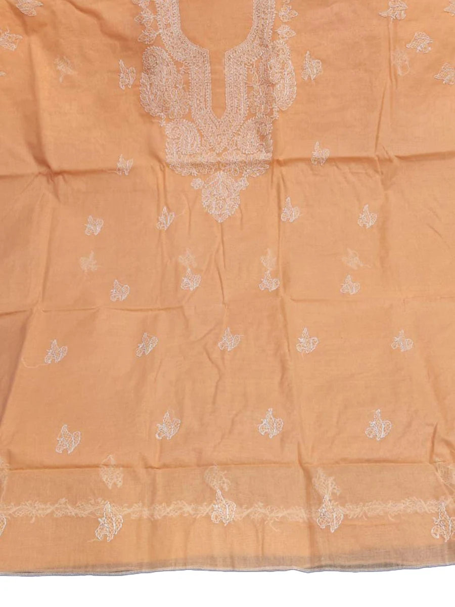 Peach blush cotton dress material with intricate shadow and fanda Chikankari embroidery in matching thread on soft voile cotton fabric, folded neatly on a textured surface (Dniza Chikankari)