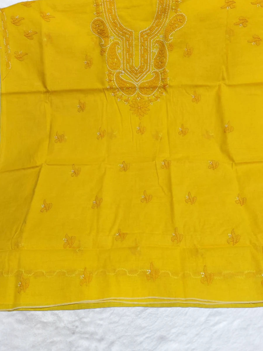 Bright yellow voile cotton dress material with delicate white shadow and fanda embroidery, ideal for haldi ceremonies and summer wear, displayed on a flat lay with elegant ethnic styling(Dniza Chikankari)