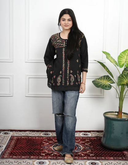 Black short kurti featuring detailed Chikankari thread work on neckline and sleeves

