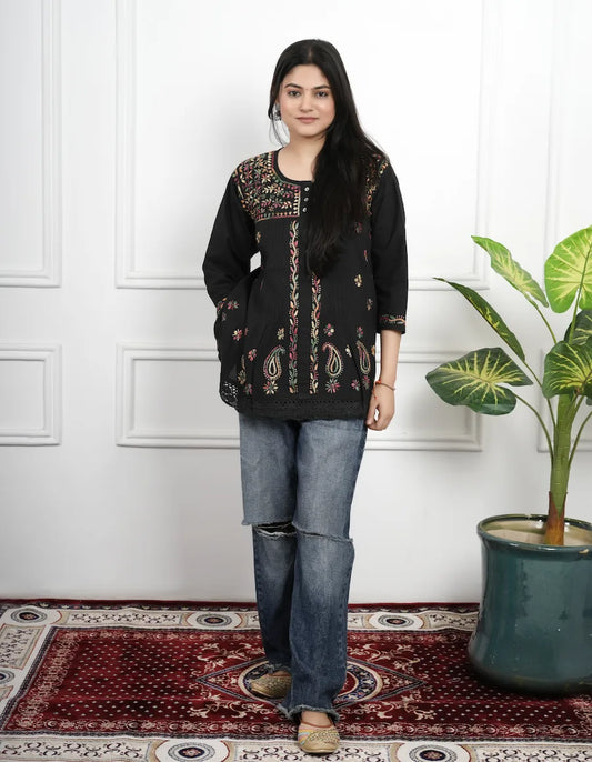 Black short kurti featuring detailed Chikankari thread work on neckline and sleeves

