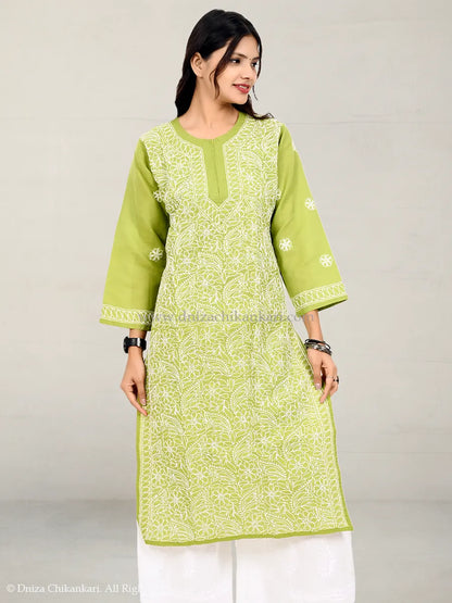 Light green chikankari kurti with white hand embroidery, worn with white palazzo pants
