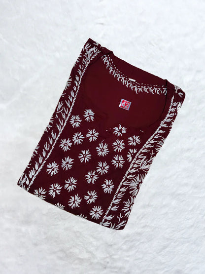 Maroon cotton kurti featuring white hand-embroidered gala booti and sleeve detailing

