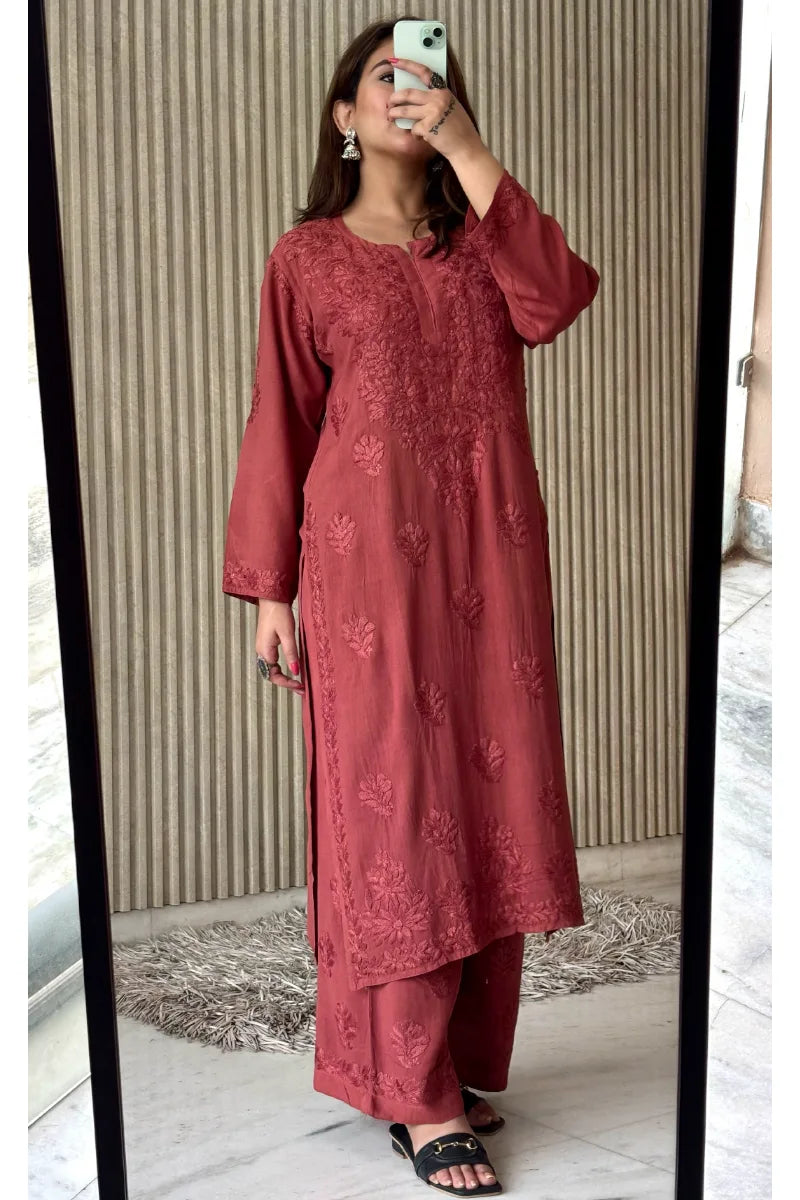 Model wearing rosewood pink rayon kurti with 3 boota embroidery and matching bottom set
