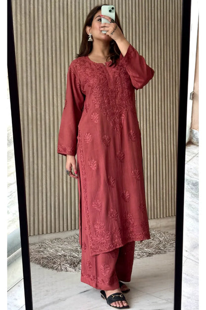 Model wearing rosewood pink rayon kurti with 3 boota embroidery and matching bottom set