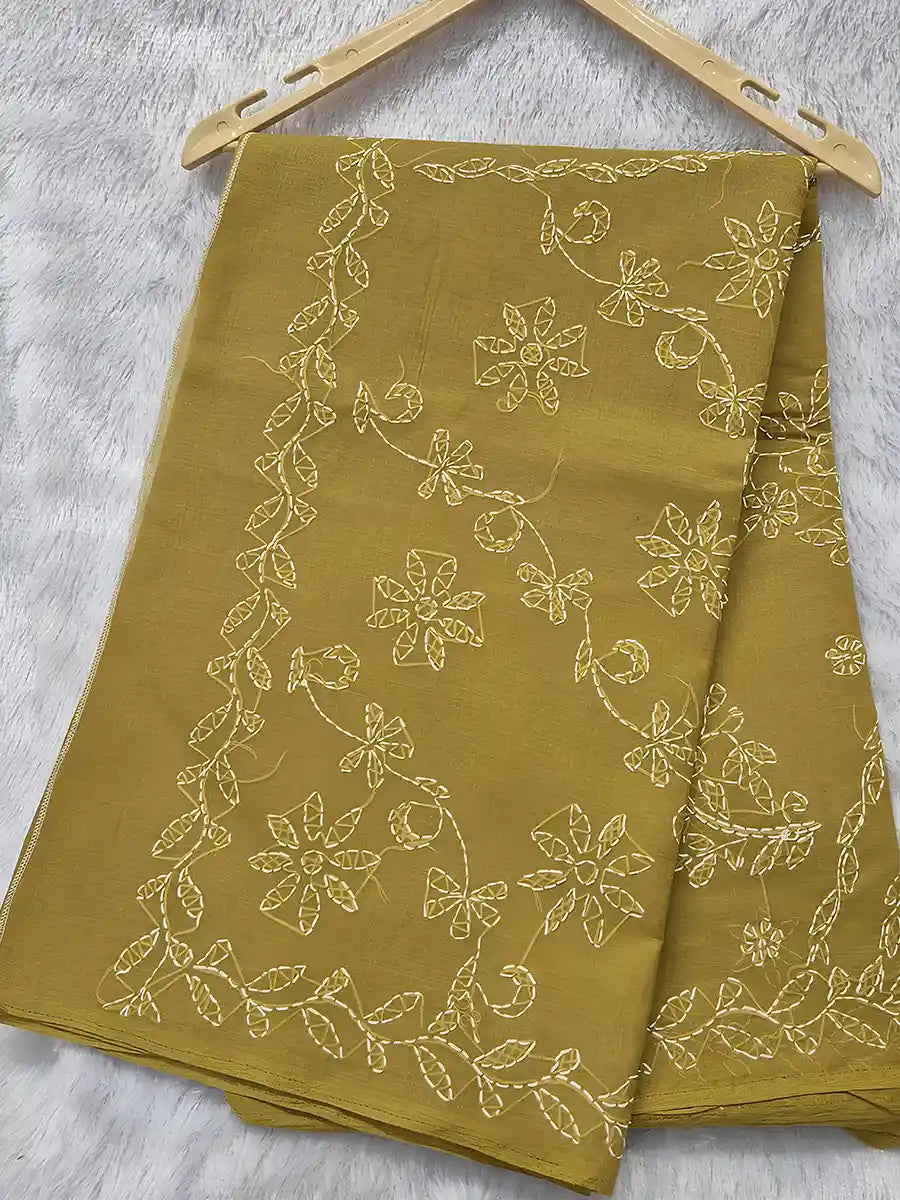 Mustard olive cotton saree with white shadow embroidery and floral patterns for ethnic wear