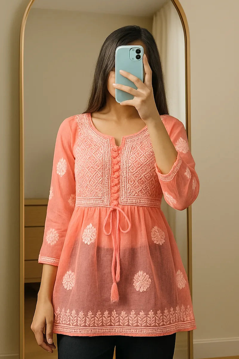 Bright orange Chikankari kurti in breathable georgette fabric, perfect for summer styling"

