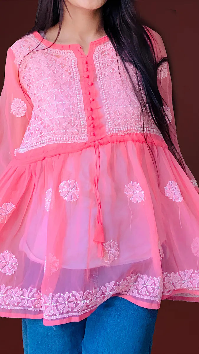 "Pink short Chikankari kurti in flowy georgette fabric featuring traditional handwork"

