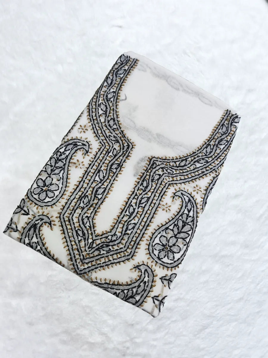 Pure white cotton dress material with subtle white-on-white embroidery in traditional design.

