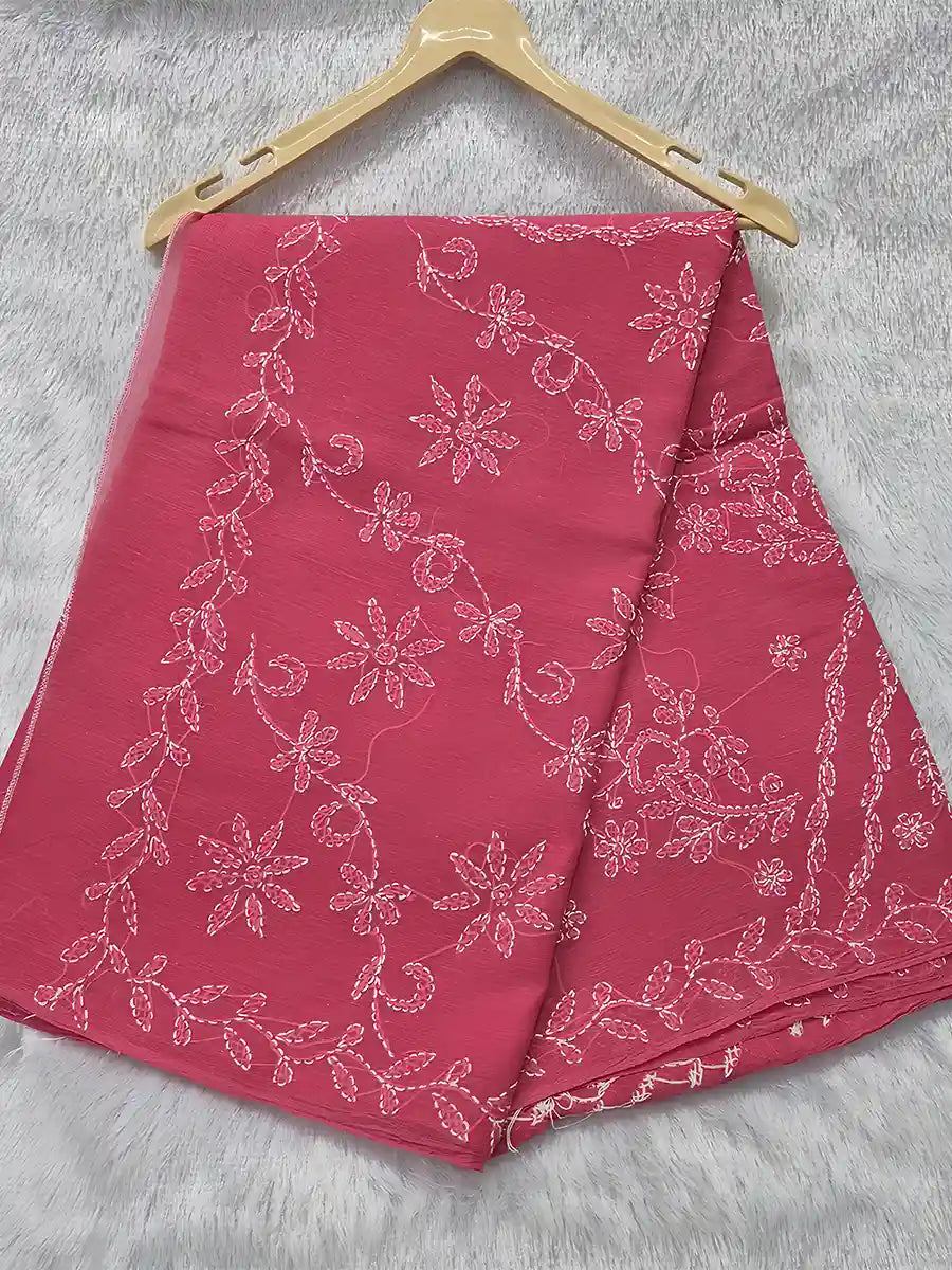 Rani pink cotton saree featuring white floral shadow embroidery for an elegant festive look