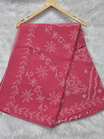 Rani pink cotton saree featuring white floral shadow embroidery for an elegant festive look