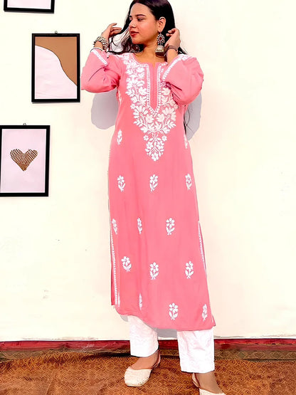 Soft coral pink rayon kurti featuring delicate white gala booti embroidery for a light festive look.

