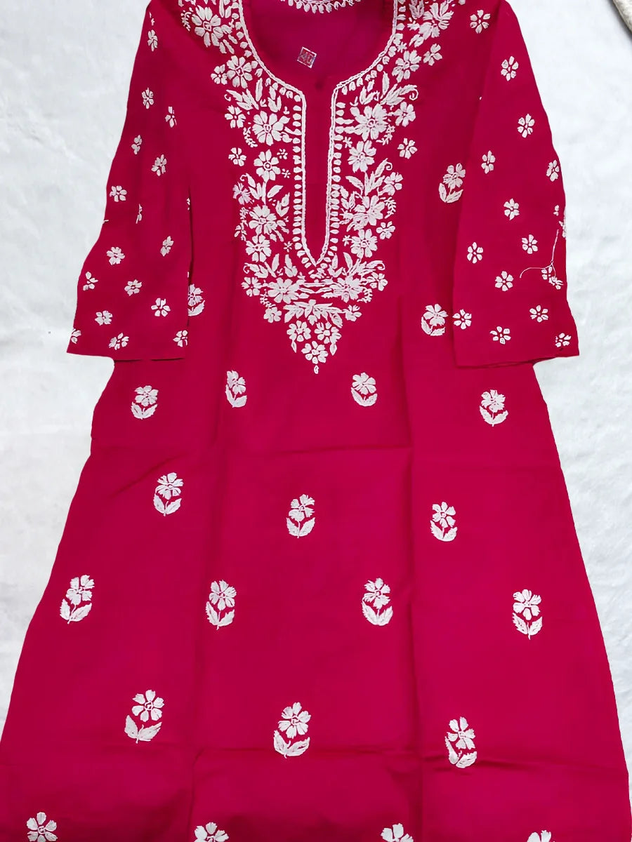 Vibrant rani pink kurti with white gala booti chikankari embroidery on chest and arms