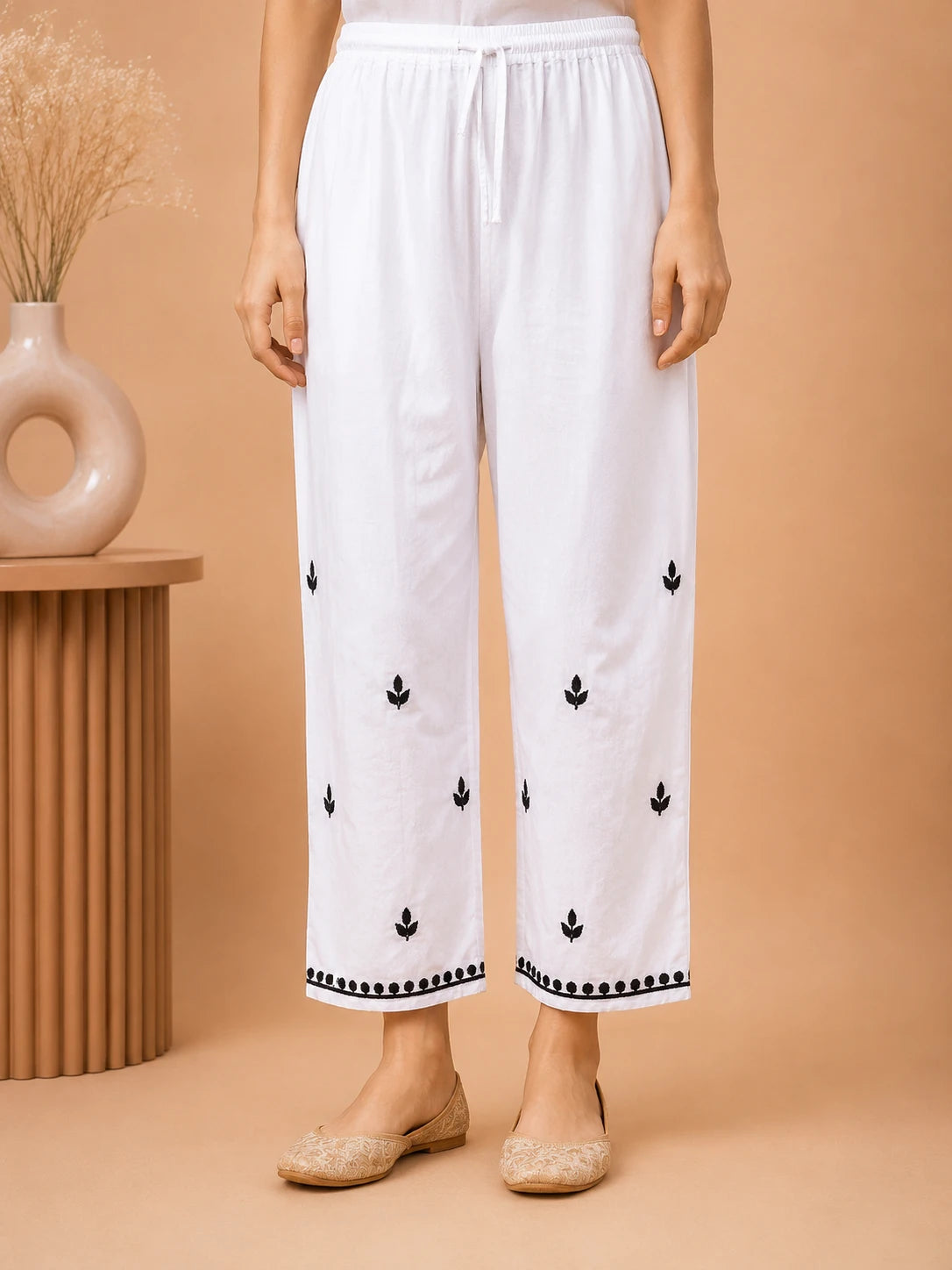 White embroidered kurta with black detailing and matching rayon pants