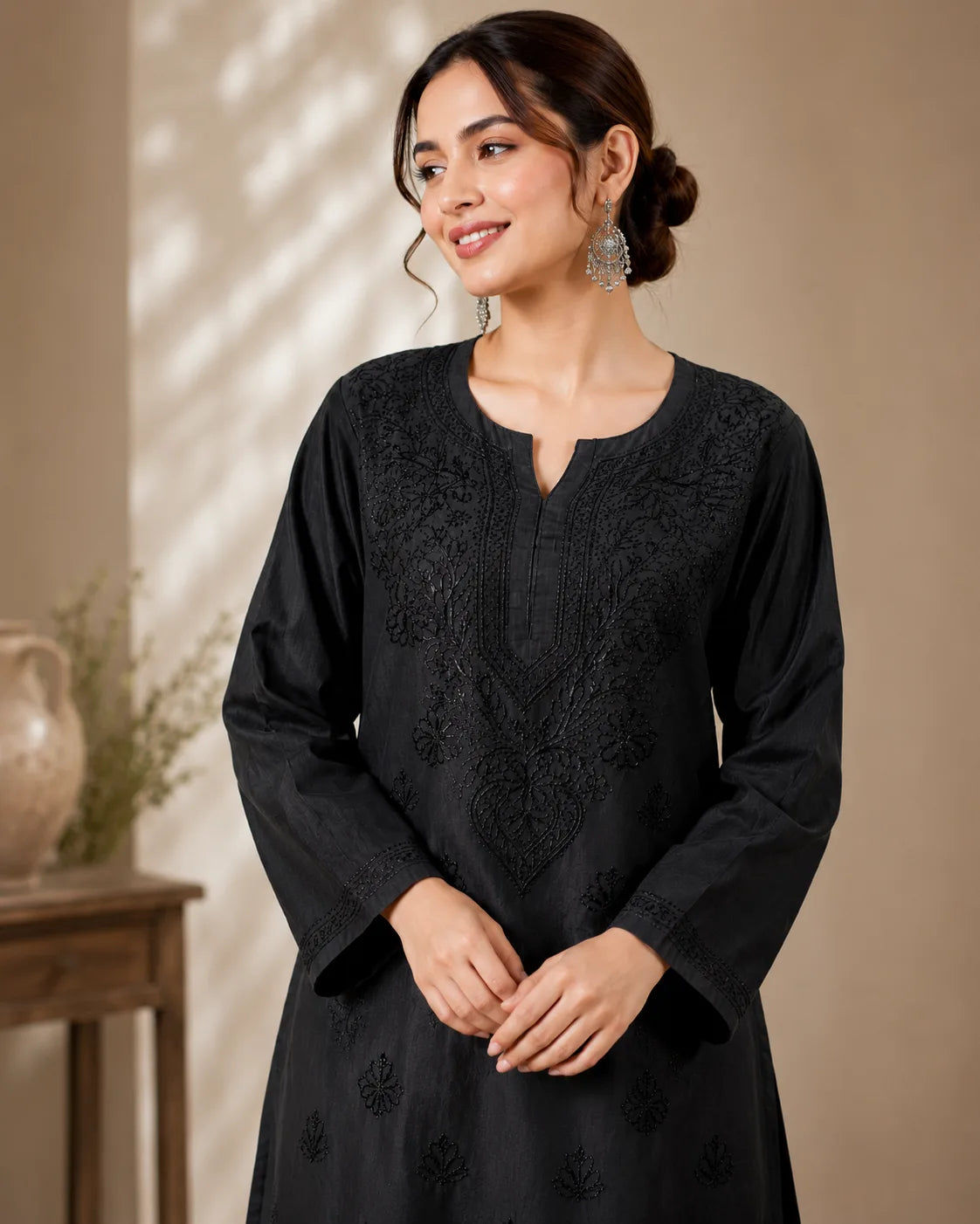Woman wearing black Chanderi Lucknowi Chikankari kurta with matching bottom