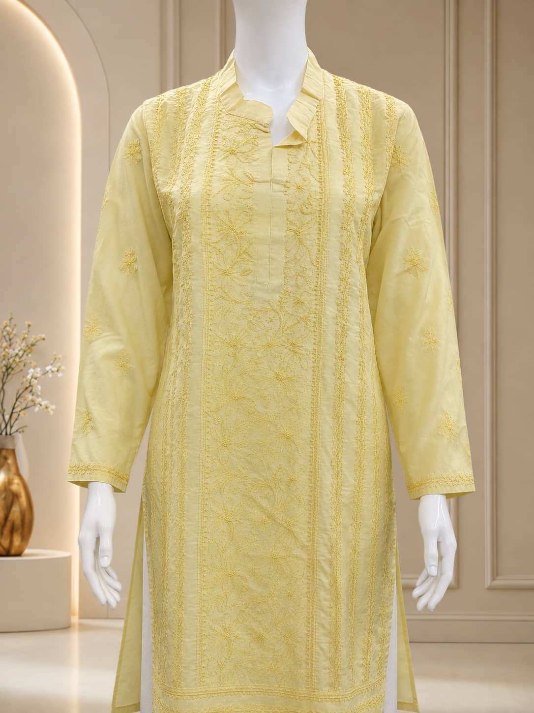 Woman wearing pastel yellow premium cotton Lucknowi Chikankari kurti