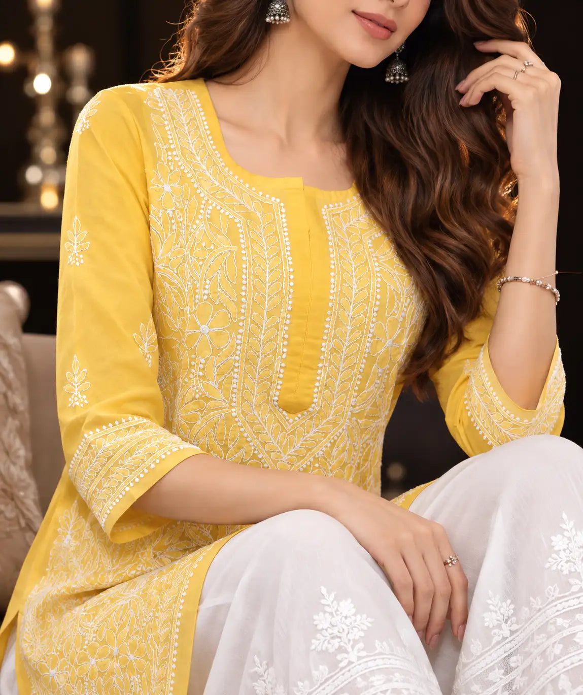 Women’s bright yellow embroidered Chikankari kurti close-up