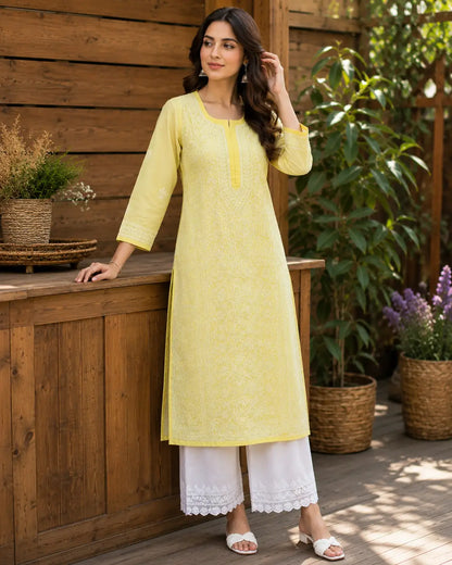 Women’s pastel yellow embroidered Chikankari kurti close-up