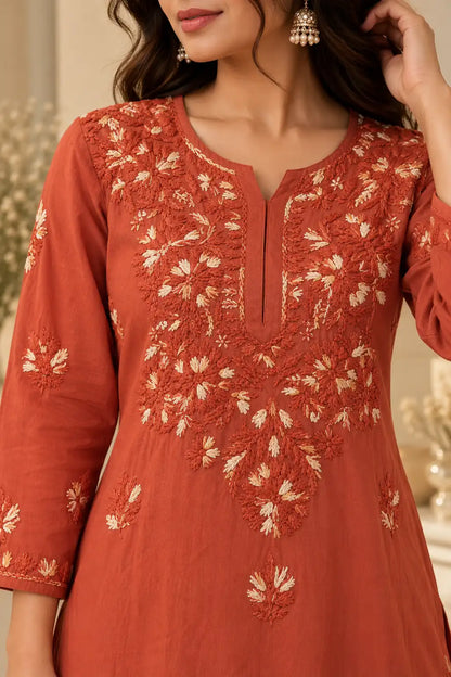 Women wearing rust orange rayon ethnic kurta with palazzo