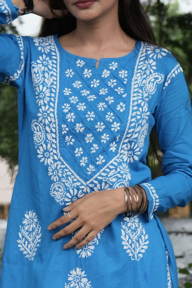 cotton chikankari kurti with intricate gala booti and sleeve embroidery, crafted in breathable sport cotton with Ancor white thread..